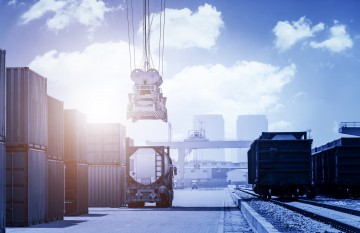 Industrial crane loading Containers in a Cargo freight ship